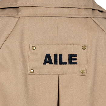 BEIGE TRENCH COAT - "THE BED".