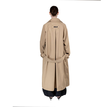BEIGE TRENCH COAT - "THE BED".