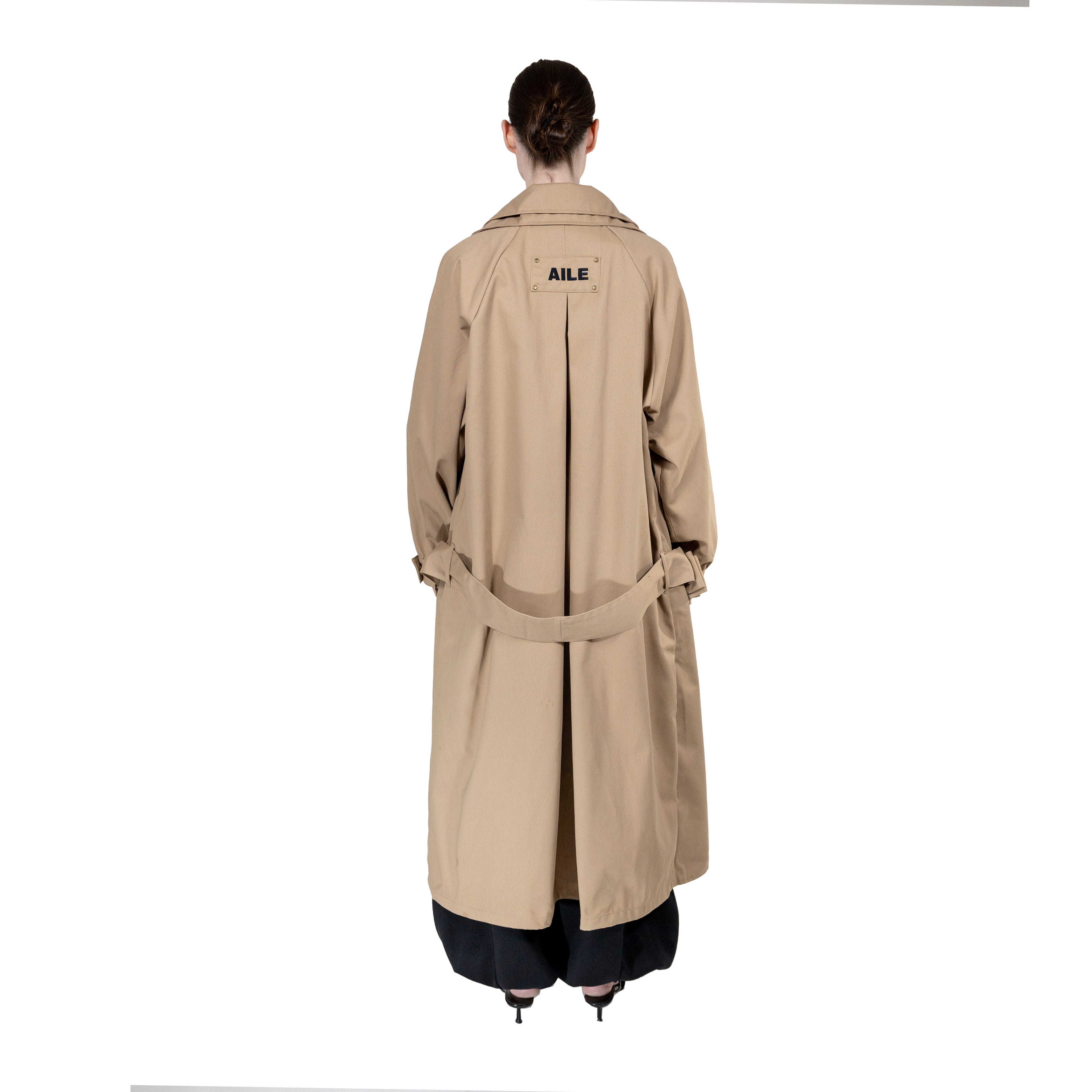BEIGE TRENCH COAT - "THE BED".