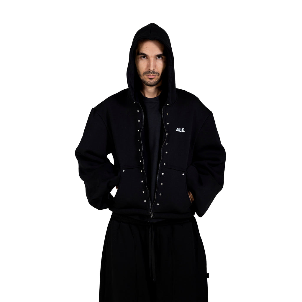 Black zip-up hoodie with crystals. Front pockets and AILE logo on the chest.