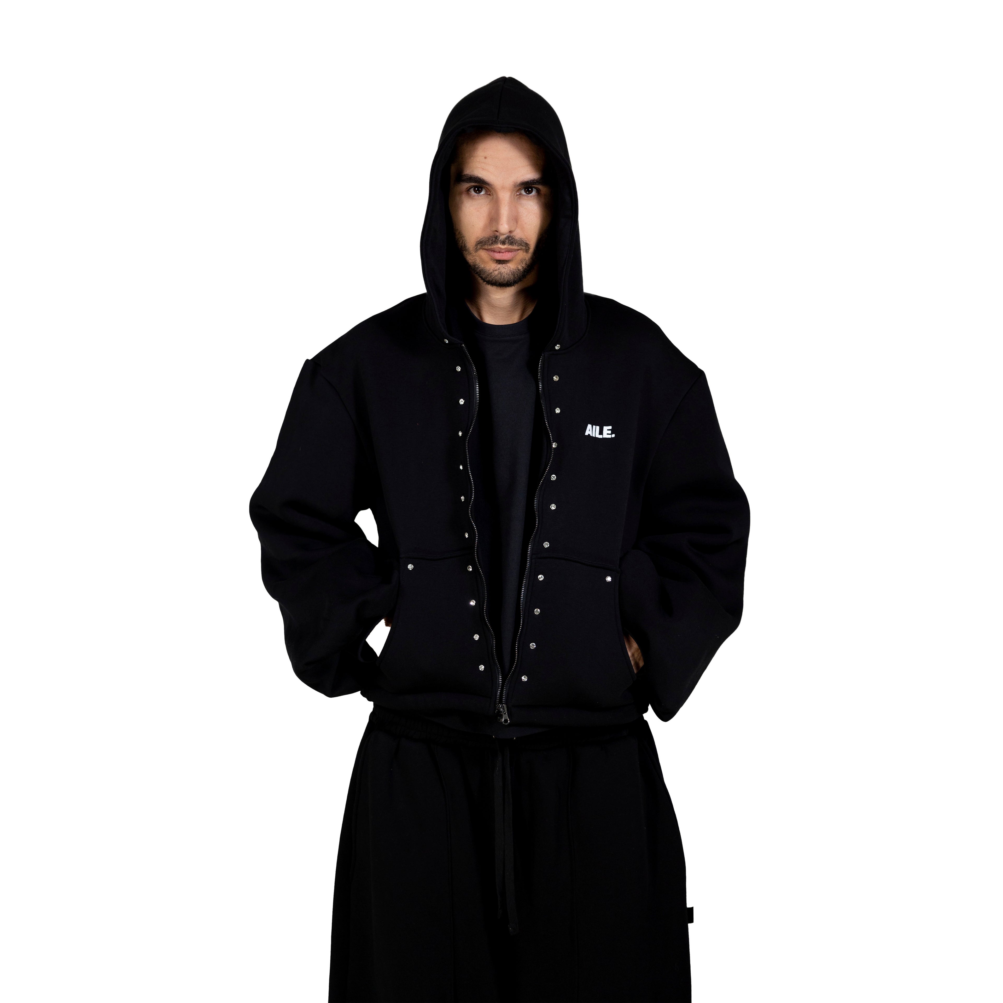 Black zip-up hoodie with crystals. Front pockets and AILE logo on the chest.