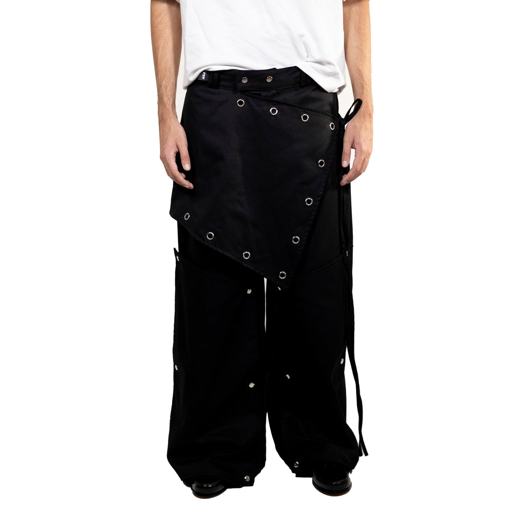 Pantalón largo con falda superpuesta y perneras extraíbles. Hecho a mano en Vigo, Galicia.