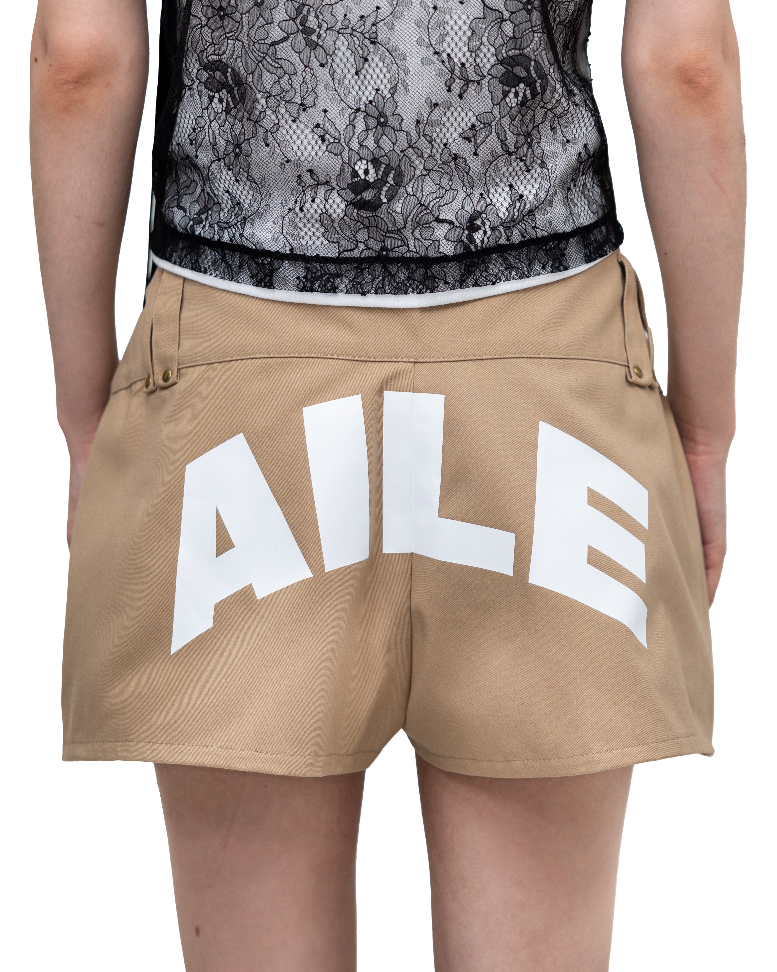 Mini shorts in twill fabric, triangle shape in beige with white printed detail on the back. Artisan made in Vigo