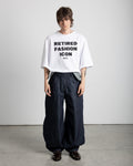 Balloon pants in 100% cotton RAW denim. Balloon-style pants with a folded waistband and a 5-panel construction. Standard front pocket, double-layered back pocket, and hidden pocket. High-quality white screen print on the back of the pants.