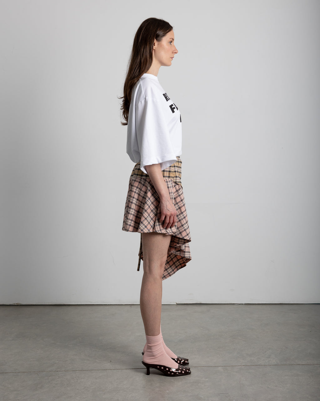 Fastens with laces on the side. Features a stainless steel pin detail on the front placket
Handmade, limited edition
