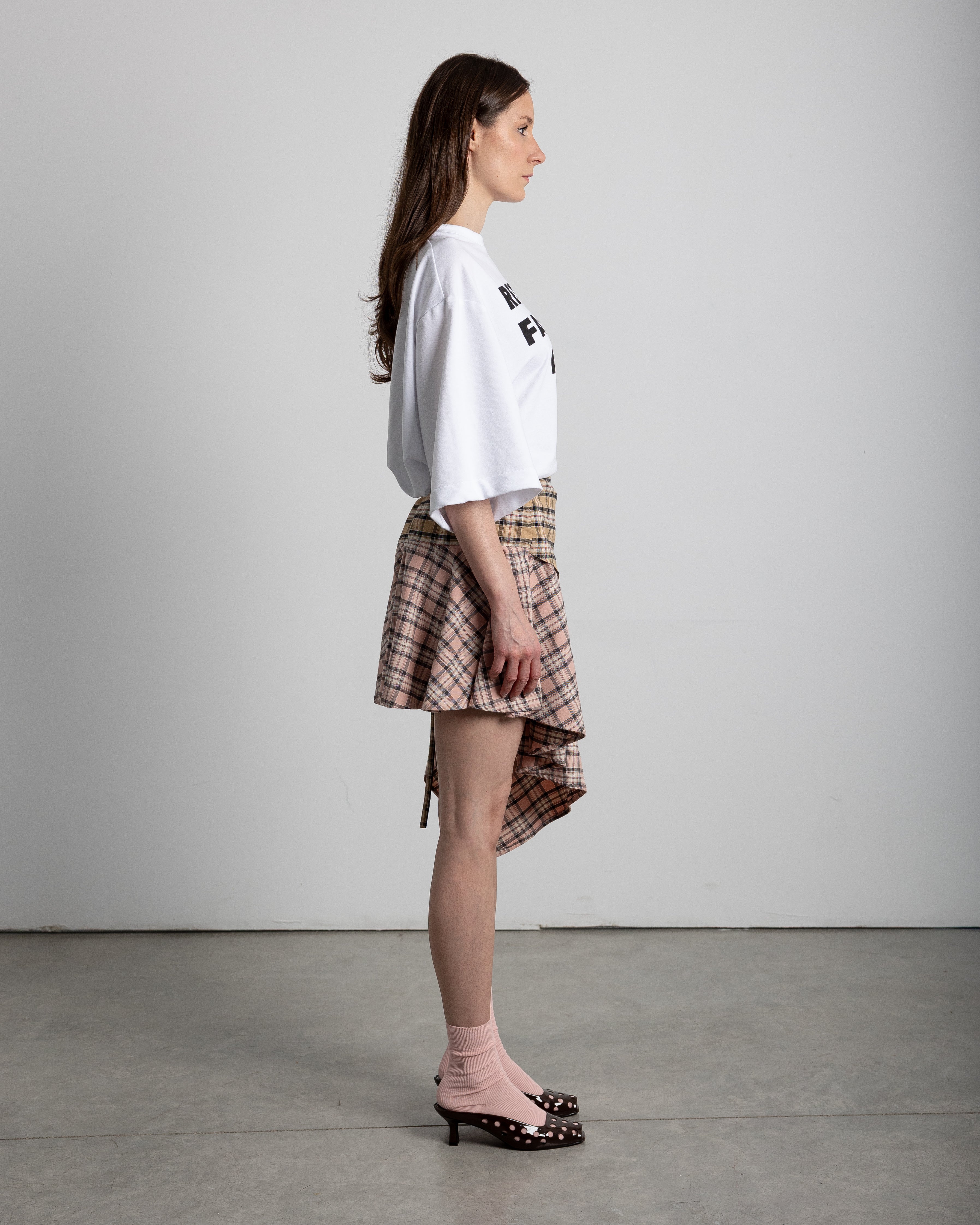 Fastens with laces on the side. Features a stainless steel pin detail on the front placket
Handmade, limited edition
